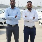 Next time you order a cab and catch that new‑car smell, thank two small‑town boys and their six‑day odyssey